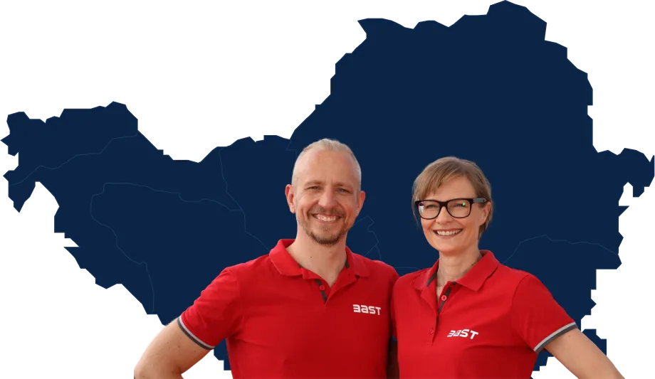 Mari and Timo Railo in front of a map of the Balkans